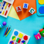 wooden kids toys on colorful paper
