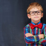 toddler boy wearing glasses and bowtie