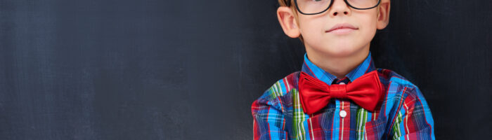 toddler boy wearing glasses and bowtie