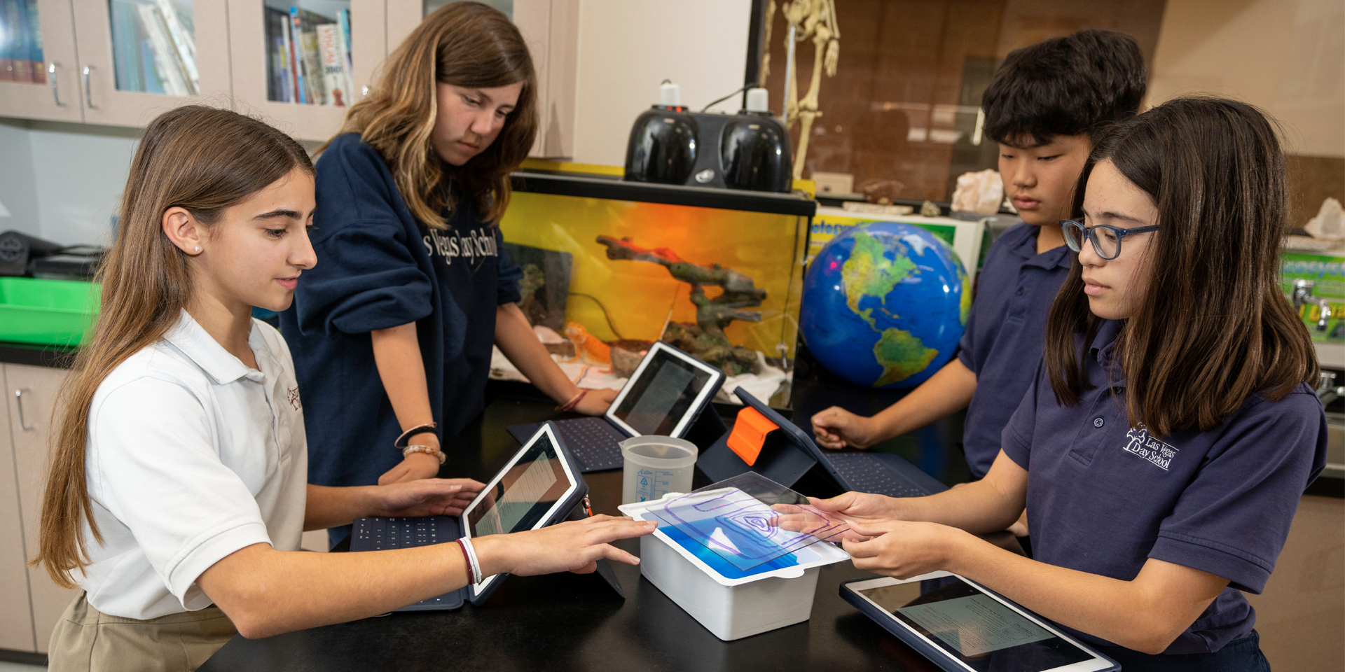 LVDS students with tablet in lab setting