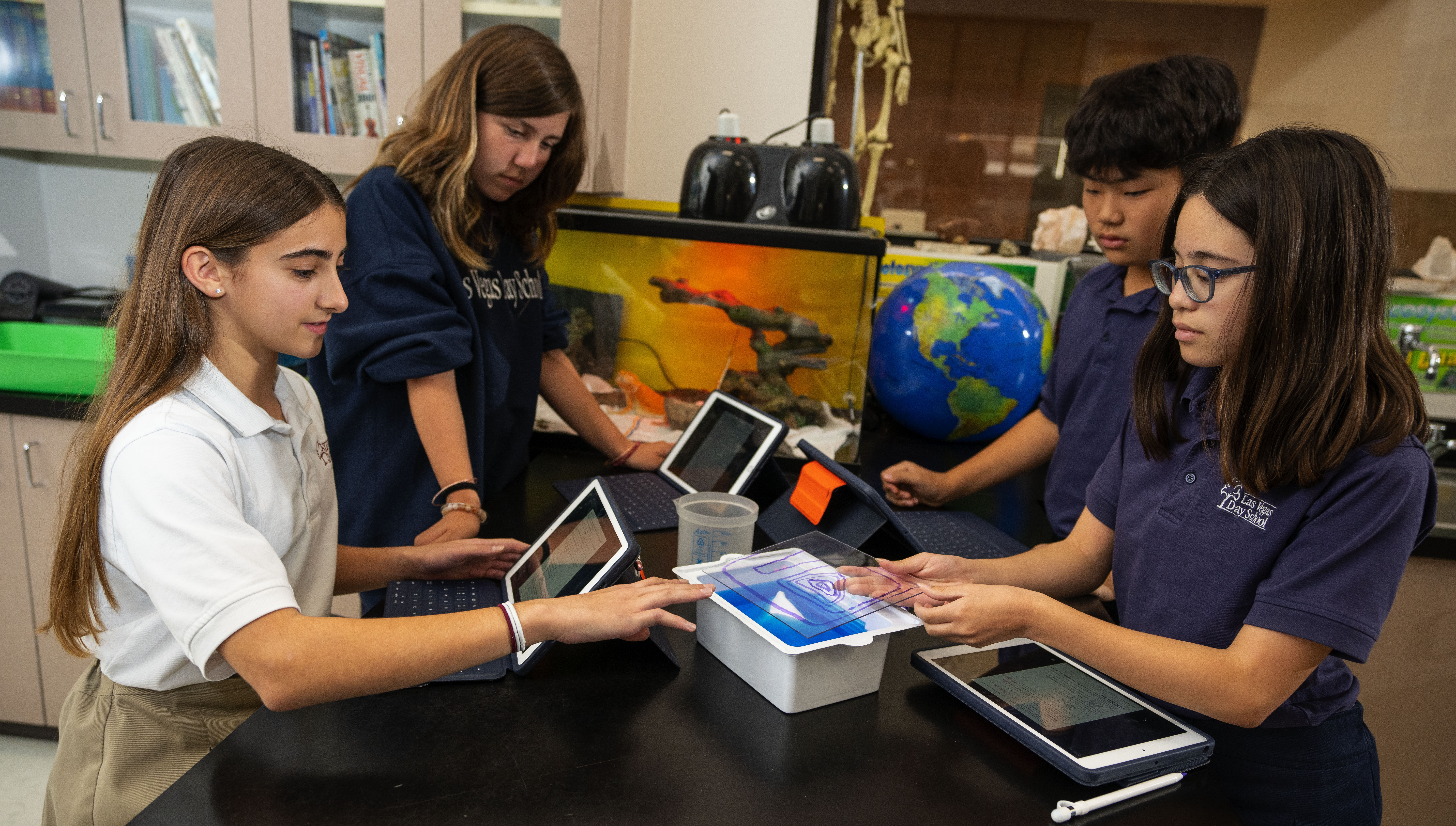 Students in a lab setting with their tablets